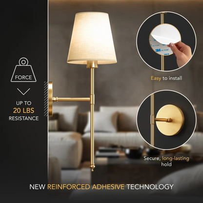 Wall-mounted lamp with gold finish and white shade, featuring text on adhesive technology.